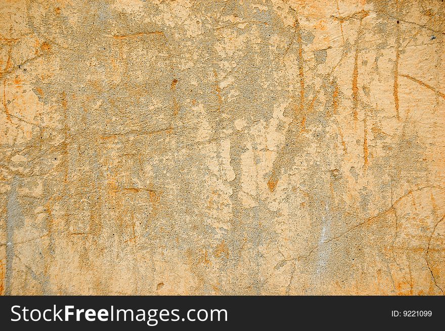 Painted gray and orange scratched wall background