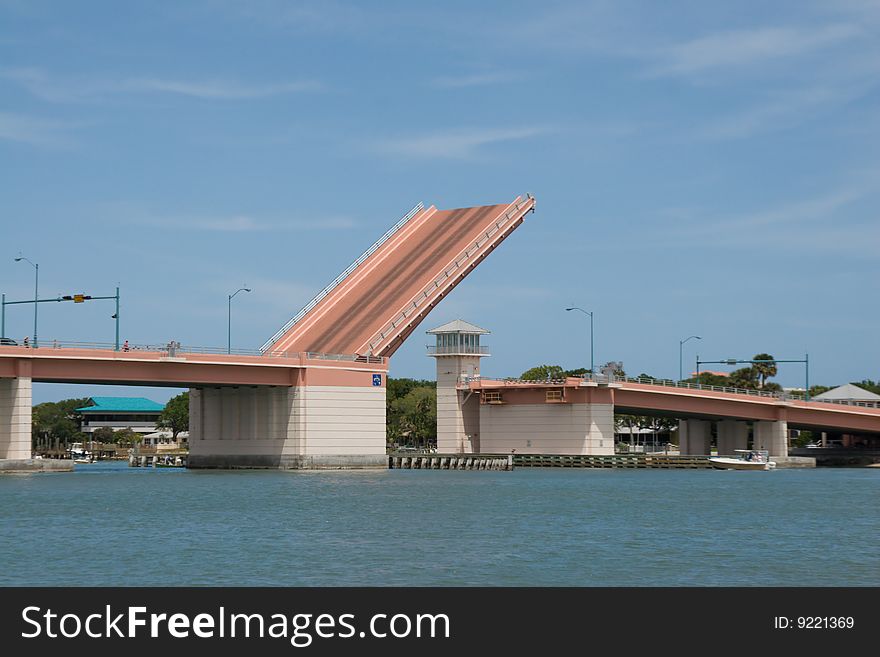A bascule bridge on the Intracoastal Waterway opens to allow a boat through. A bascule bridge on the Intracoastal Waterway opens to allow a boat through