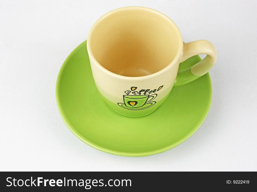 The green coffee cup is in white background