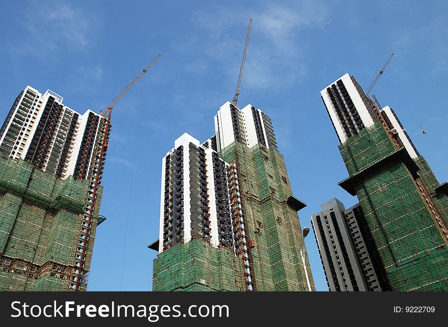 Apartment Buildings in Construction over blue sky