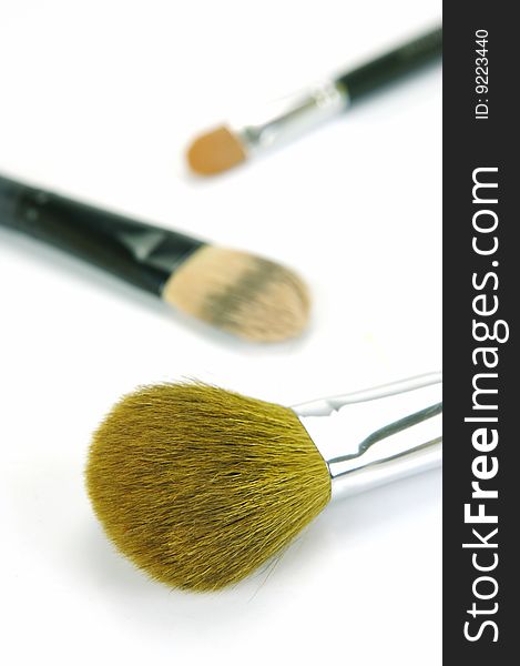 Makeup brushes isolated against a white background