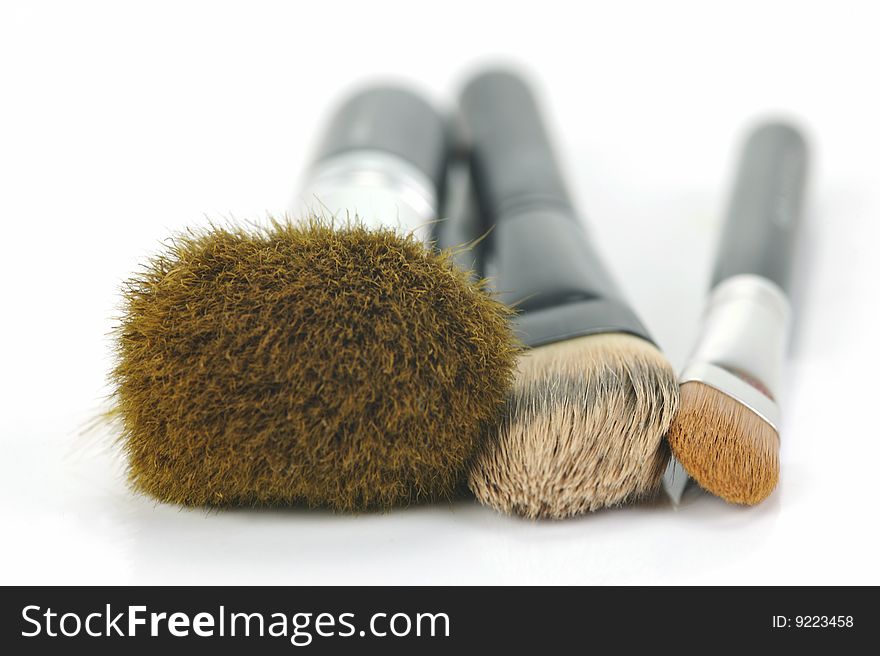 Makeup brushes isolated against a white background
