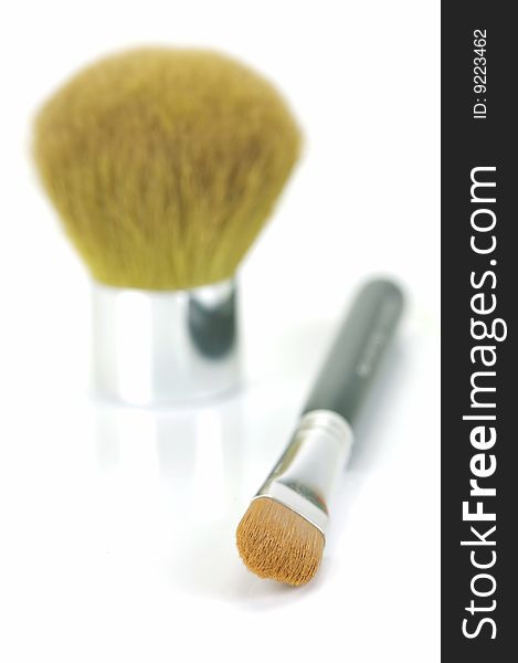 Makeup brushes isolated against a white background