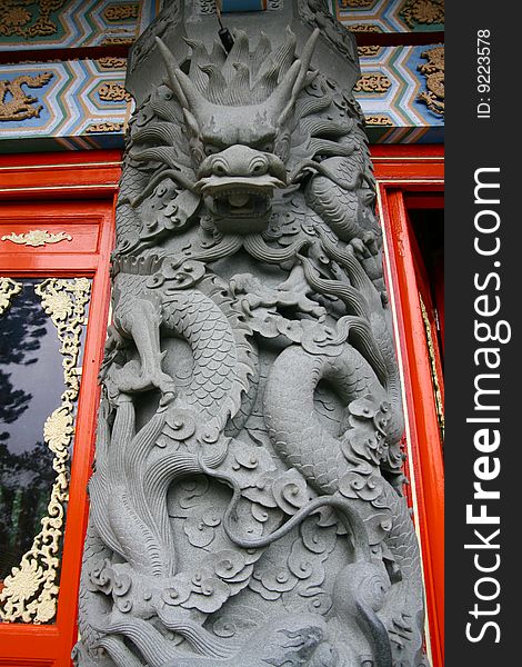 Stone Tiger Dragon ornament on a buddhist temple in Lantau Hong Kong. Stone Tiger Dragon ornament on a buddhist temple in Lantau Hong Kong