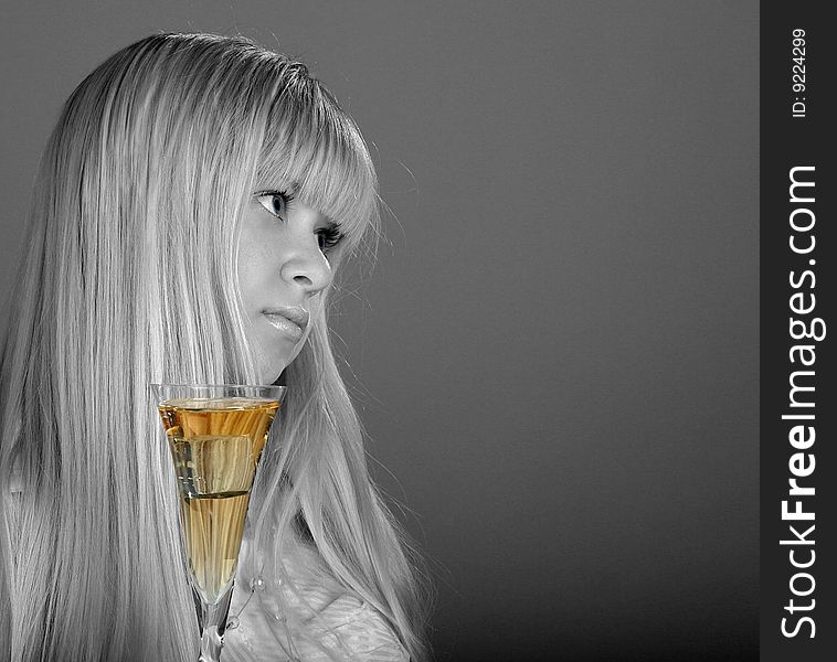 Melancholy girl with golden glass