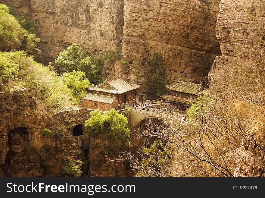 Cangyagshan, Hebei Province, China. the temples and the bridge over the deep canyon in the middle of the mountains. Cangyagshan, Hebei Province, China. the temples and the bridge over the deep canyon in the middle of the mountains