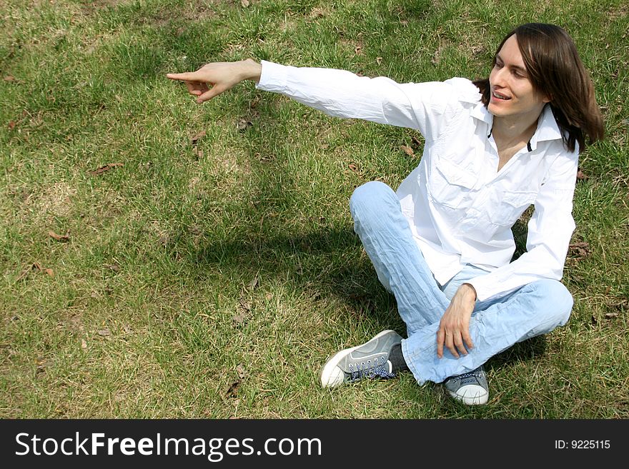 Man sitting on grass in a park