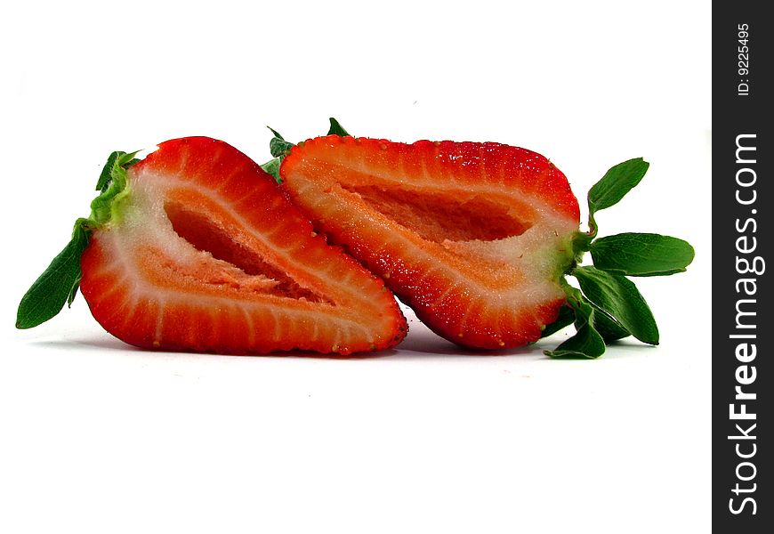 A cut strawberry on a white background. A cut strawberry on a white background