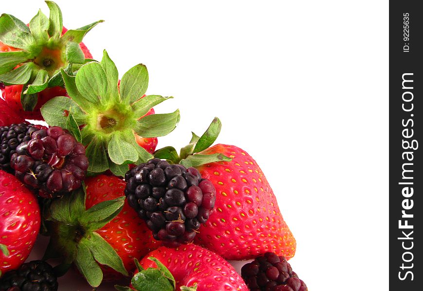 An arrangement of strawberries and blackberries on a white background. An arrangement of strawberries and blackberries on a white background