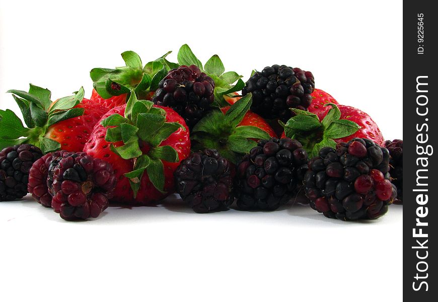 An arrangement of strawberries and blackberries on a white background. An arrangement of strawberries and blackberries on a white background