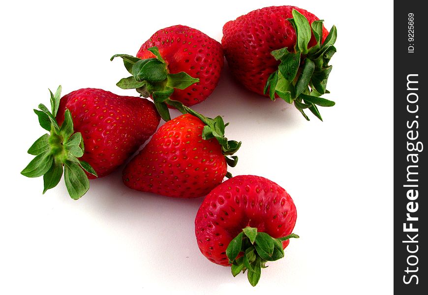 An arrangement of strawberries on a white background