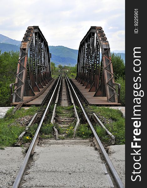 Railroad over old rusty bridge. Railroad over old rusty bridge