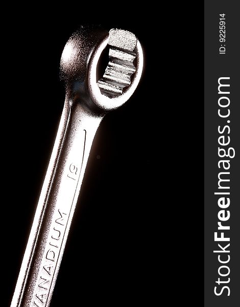 Tools series: steel wrench on black background