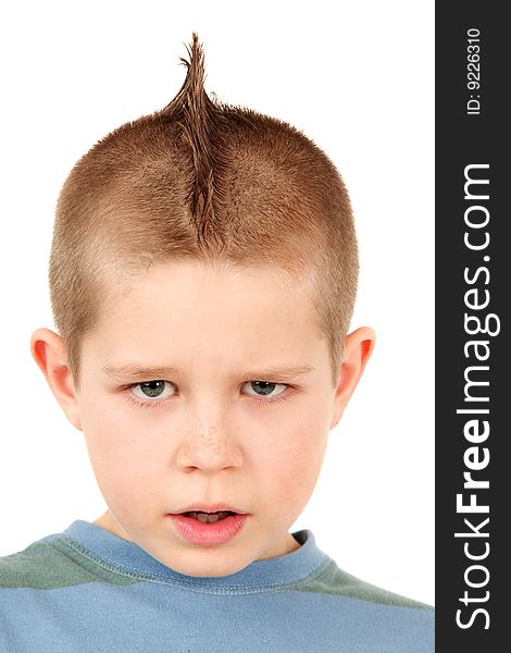 Portrait of young boy with mohawk, studio shot. Portrait of young boy with mohawk, studio shot