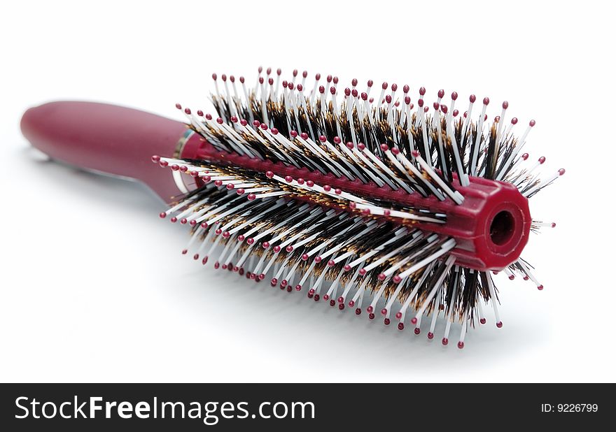 Red hairbrush isolated on white background