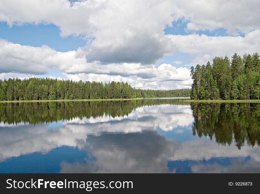 Landscape of Karelian lake and sky with clouds. Landscape of Karelian lake and sky with clouds