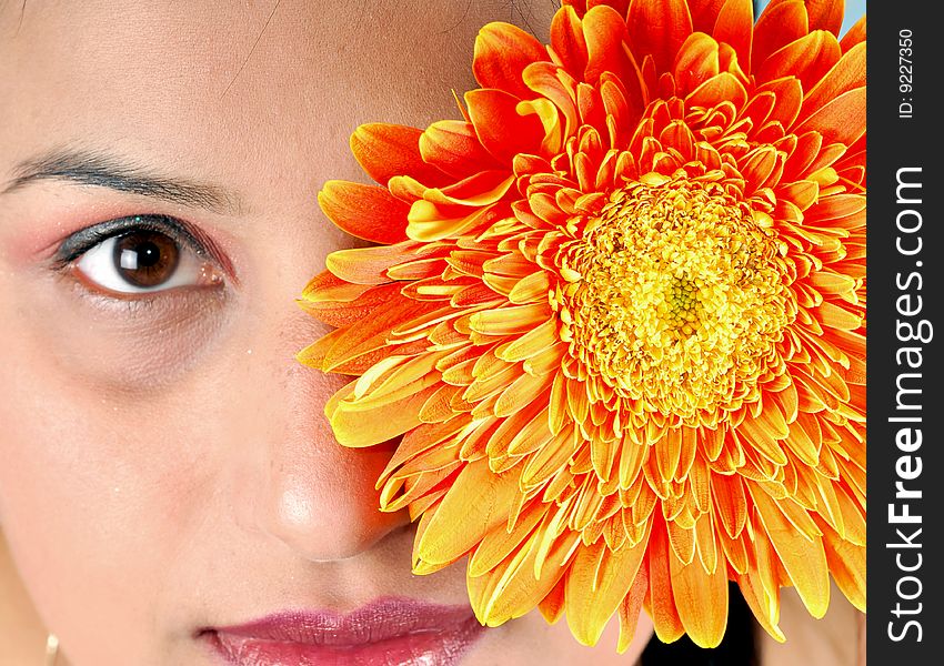 Indian girl with orange flower. Indian girl with orange flower.