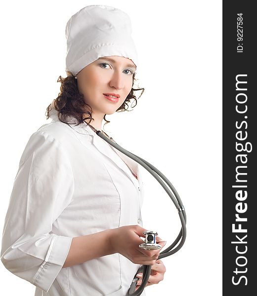 Doctor in a white robe and cap uniform with a stethoscope in the hands of