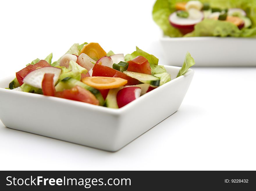 Isolated fresh salad in a white plate
