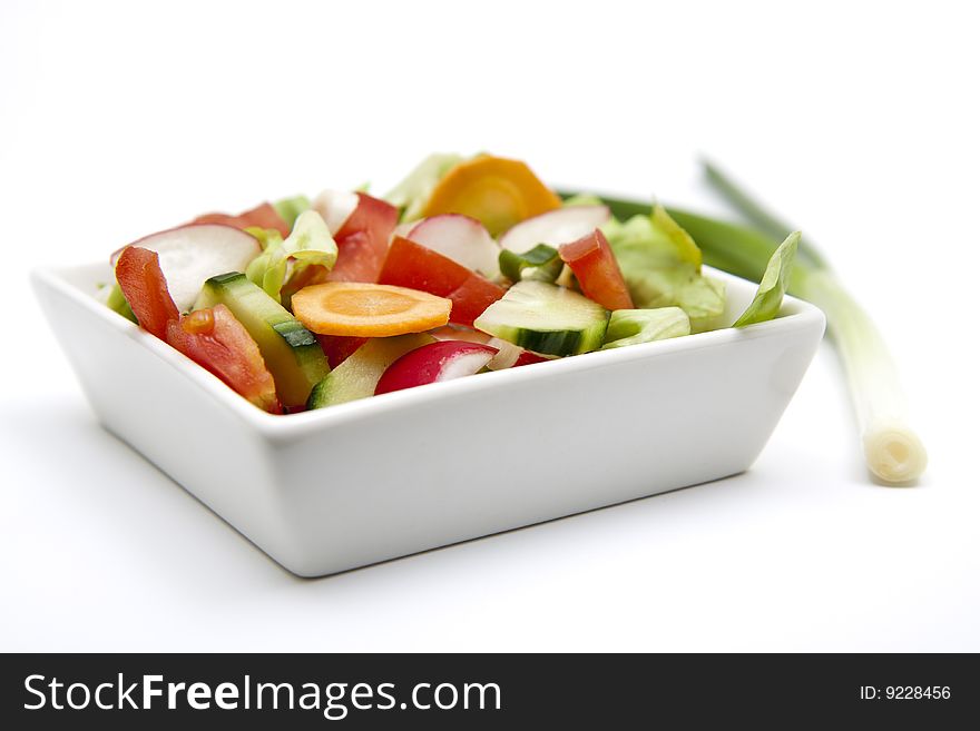 Isolated mixed salad with green onion
