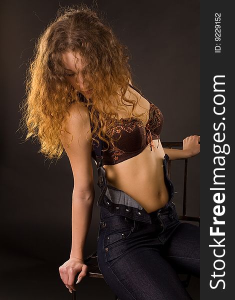 Attractive red-haired girl, studio shot