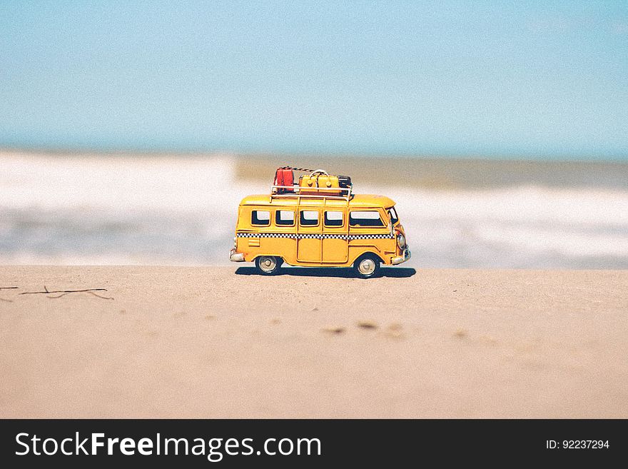 A toy Volkswagen on a beach. A toy Volkswagen on a beach.