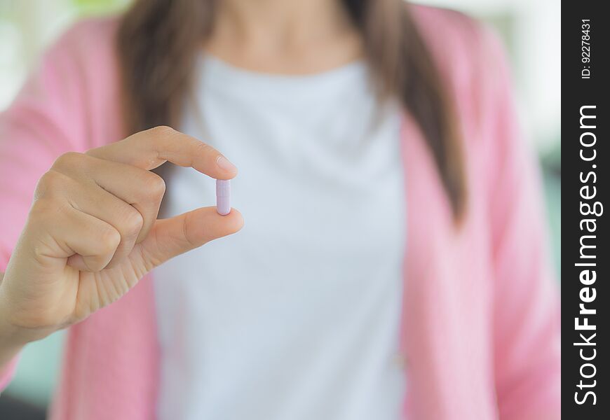 Medicine, health care and people concept - close up of woman taking in pill. Medicine, health care and people concept - close up of woman taking in pill