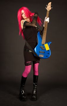 Attractive Girl Putting On Bass Guitar Royalty Free Stock Photos Attractive Girl Putting On Bass Guitar Royalty Free Stock Photos