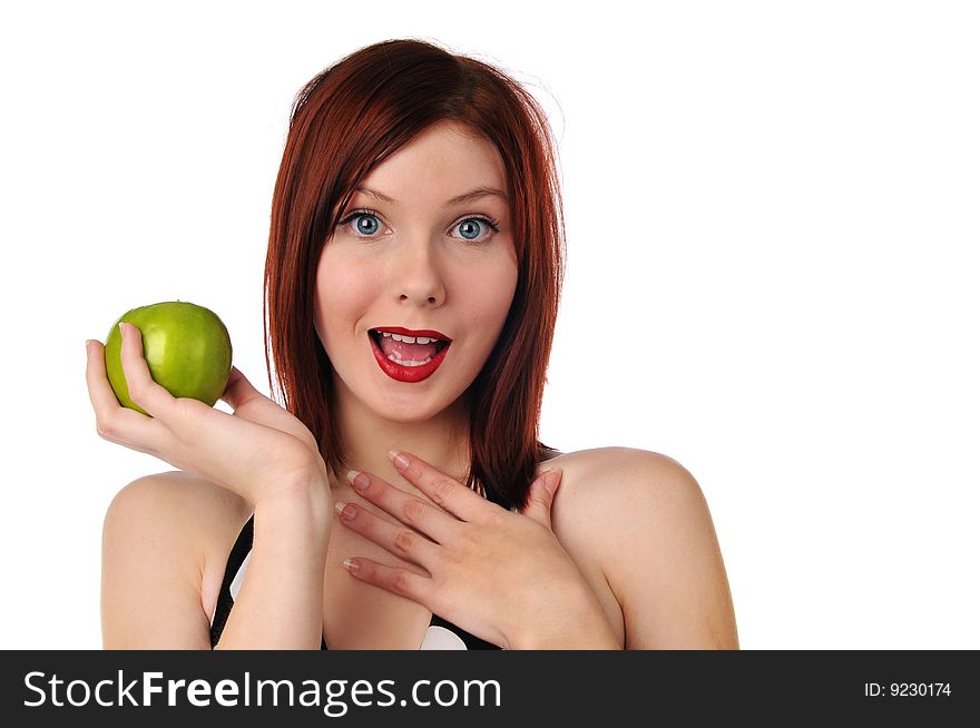 Young redhead woman holding an apple isolated on a white background. Young redhead woman holding an apple isolated on a white background