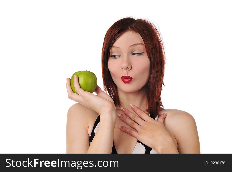 Young redhead woman holding an apple isolated on a white background. Young redhead woman holding an apple isolated on a white background