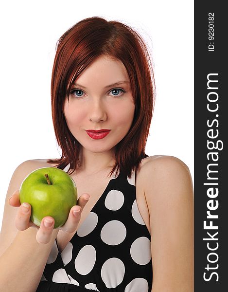 Young redhead woman holding an apple isolated on a white background. Young redhead woman holding an apple isolated on a white background