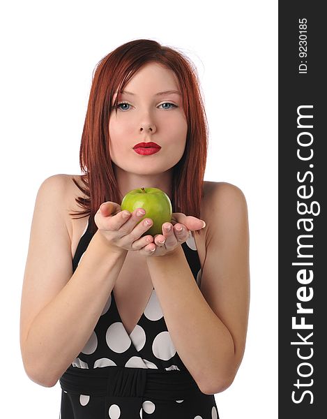 Young redhead woman holding an apple isolated on a white background. Young redhead woman holding an apple isolated on a white background