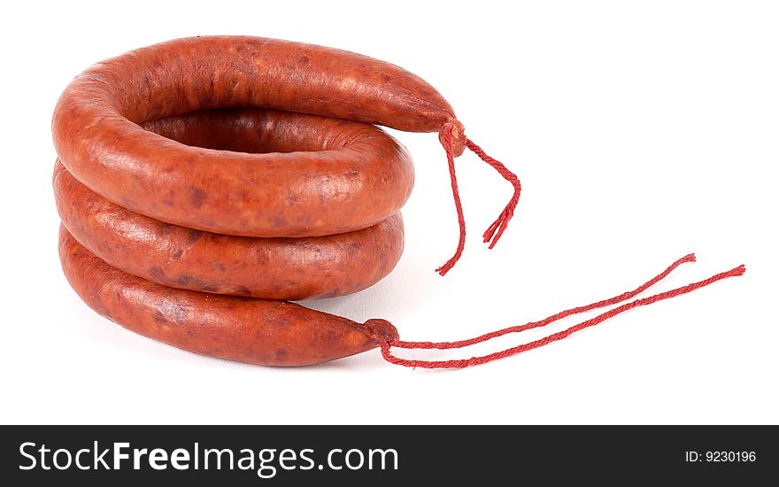 Sausage wrapped and stacked on a white background. Sausage wrapped and stacked on a white background