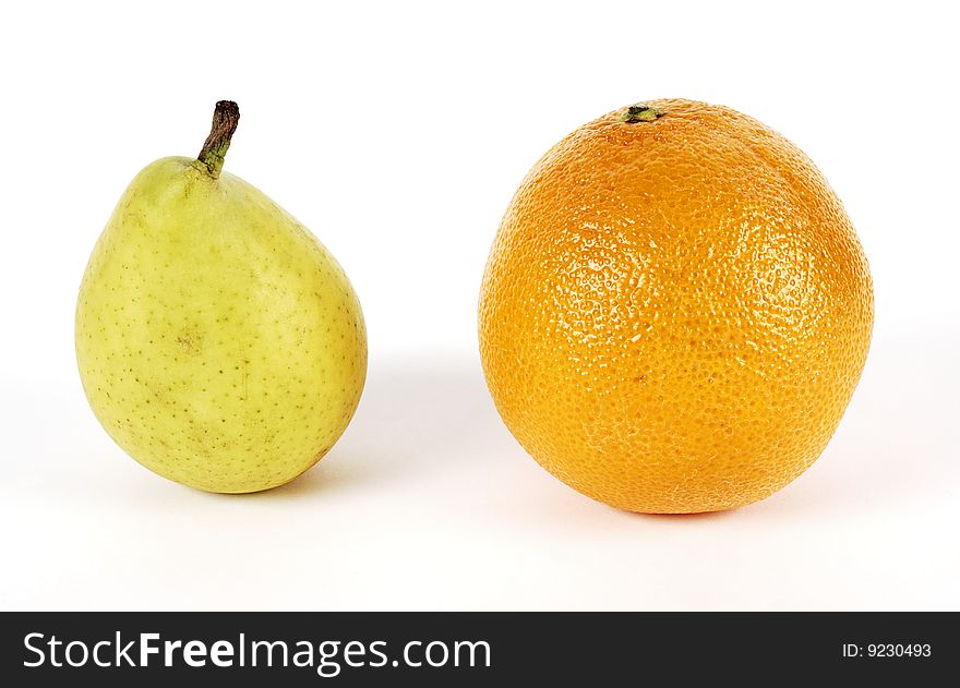 Pear and orange on white background. Pear and orange on white background