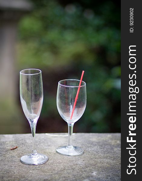 Two empty glasses on a stone wall. Two empty glasses on a stone wall