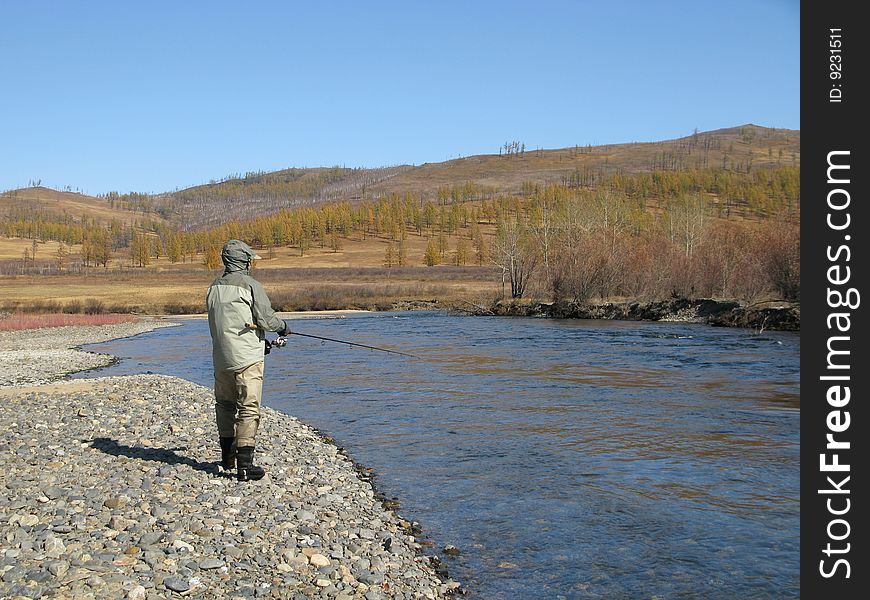 Fishing on river in wildness