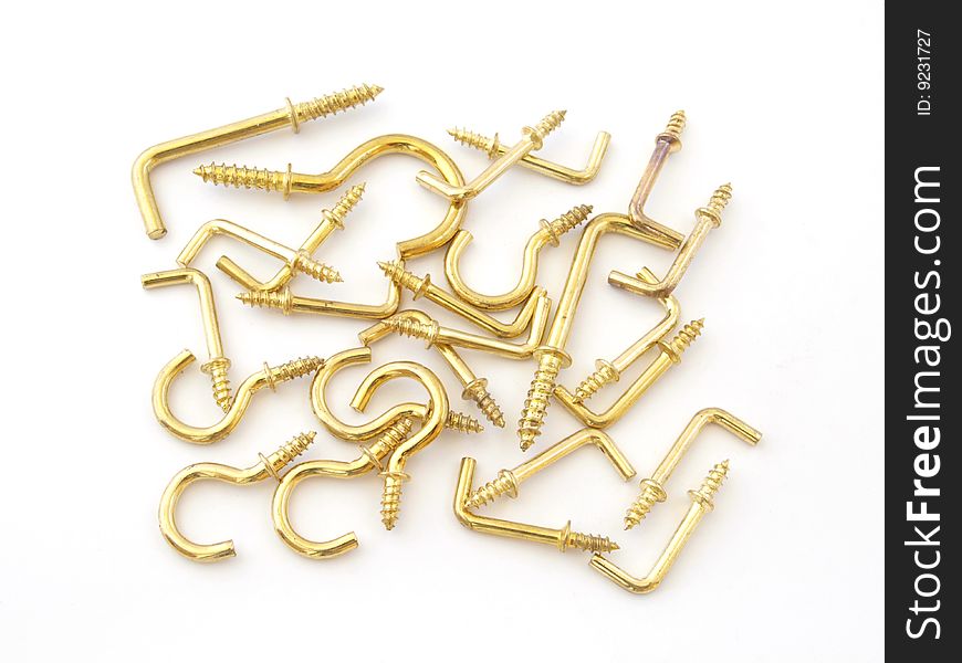 Assorted brass hookes used for hanging light objects. Assorted brass hookes used for hanging light objects.