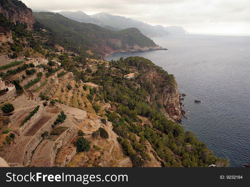 Steep coast in levels on the West side of island in Mediterranean sea. Steep coast in levels on the West side of island in Mediterranean sea