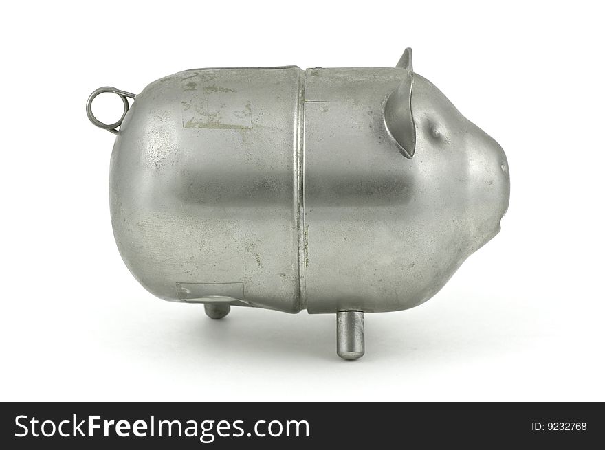 A metal piggy bank in damaged condition. A metal piggy bank in damaged condition.