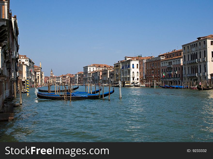 Venice channel with gondolas in the summer. Venice channel with gondolas in the summer