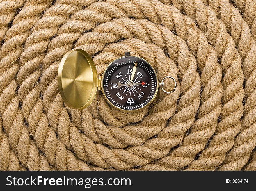 A beautiful golden compass on a rope