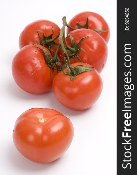 Group red tomato isolated on white background.