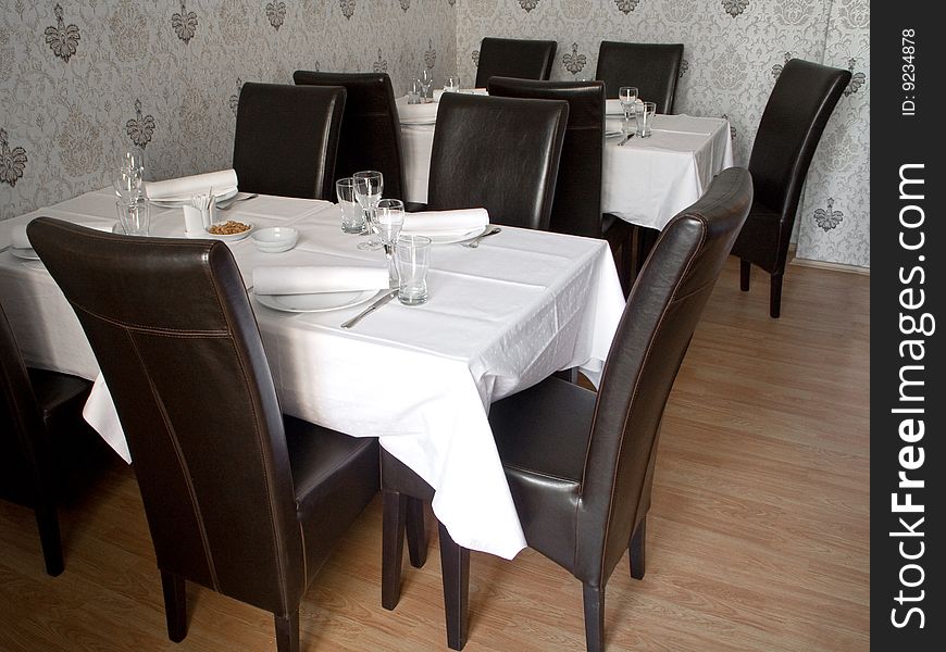 Table with cutlery, plaits and glasses in Restaurant. Table with cutlery, plaits and glasses in Restaurant