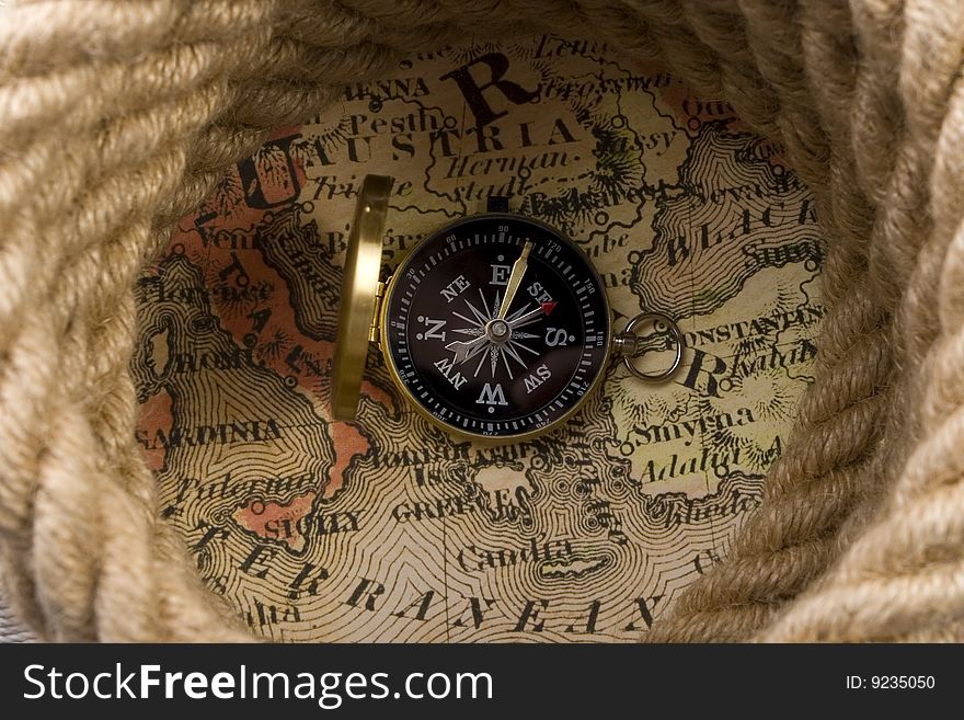 A beautiful golden compass on a background