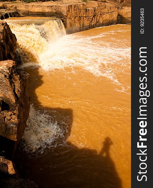 Turbid water of tropical waterfall after hard rain, north of Thailand