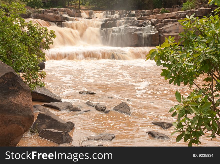 Turbid water of tropical waterfall after hard rain, north of Thailand