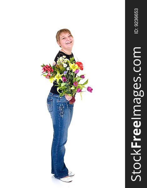 Happy smiling young girl presenting flowers, white background, studio shot