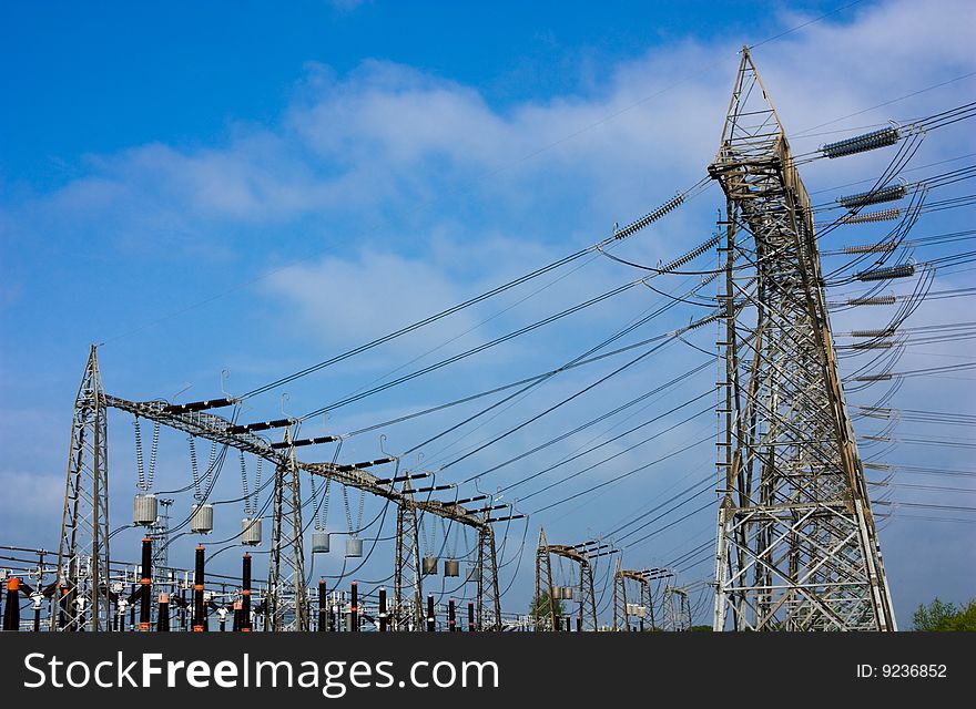 High voltage pylons, transformer and insulators, electrical distribution, overhead line. High voltage pylons, transformer and insulators, electrical distribution, overhead line