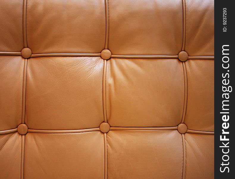 Square tuck pattern on a leather sofa. Square tuck pattern on a leather sofa.