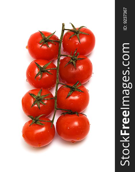 Fresh tomatoes and red on a white background